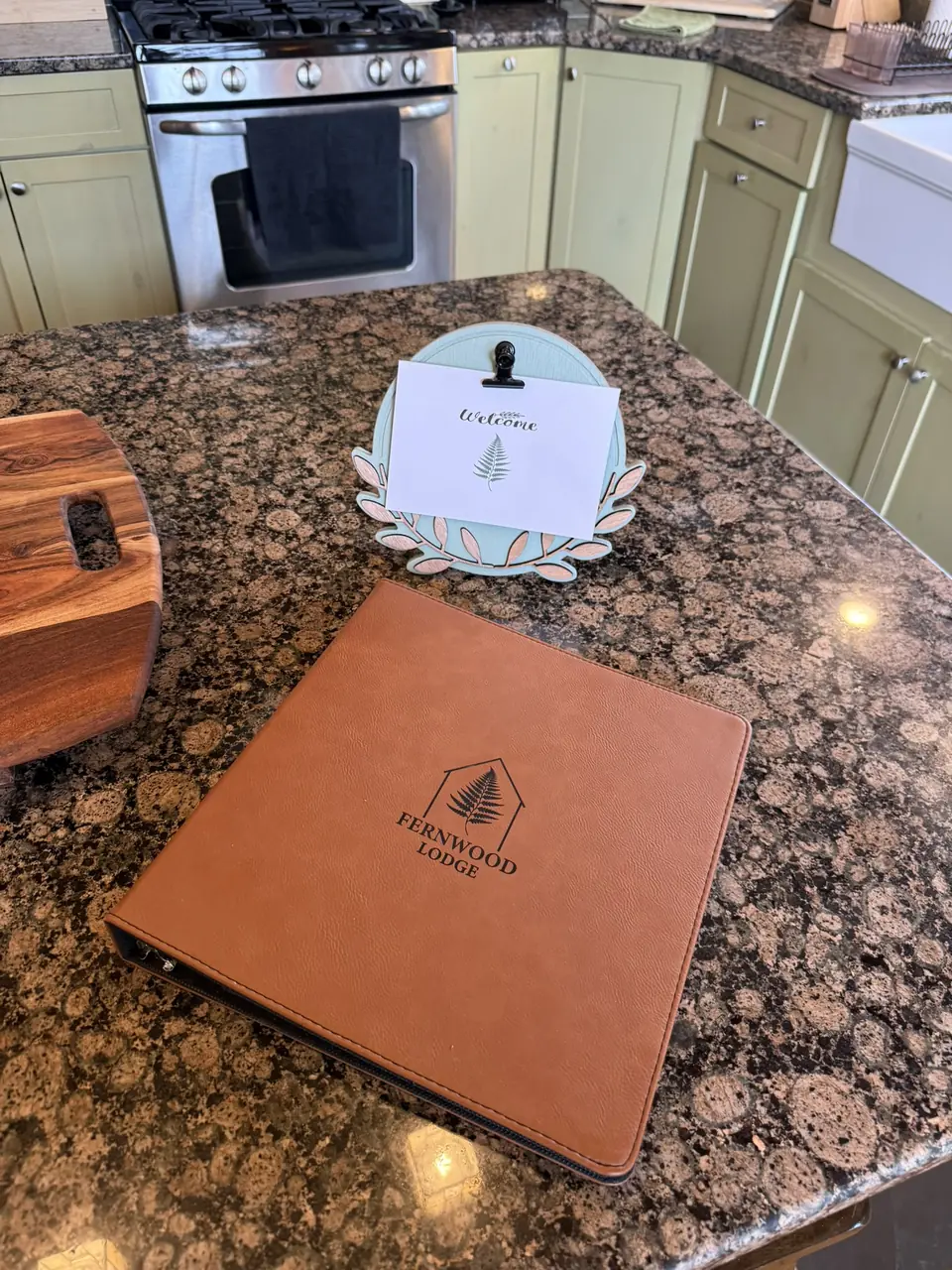 Fernwood Lodge welcome book on the kitchen counter